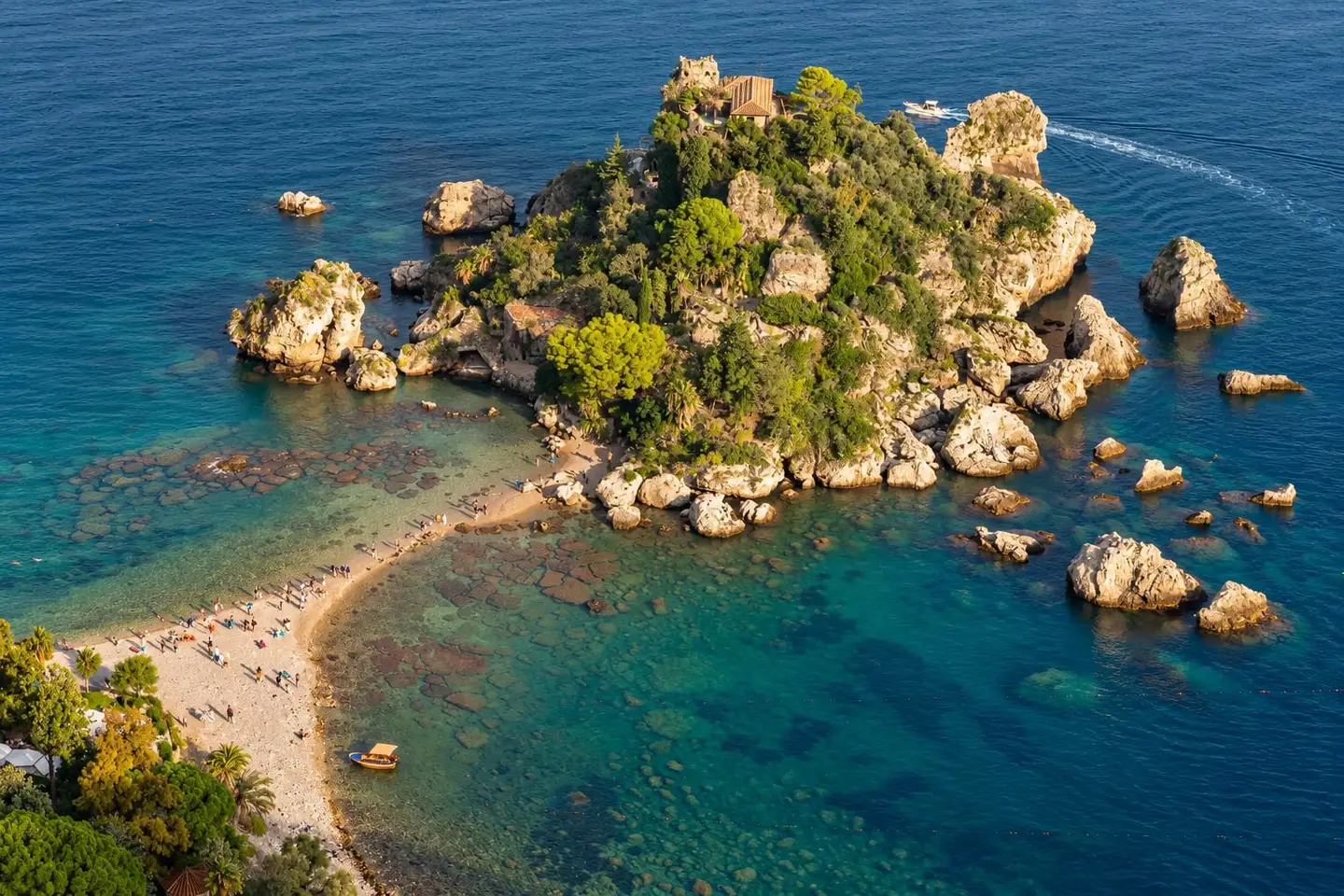 Isola Bella curling into the Ionian at Taormina, Sicily